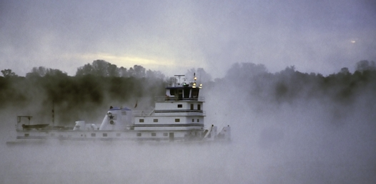 Towboat in fog on the Mississippi